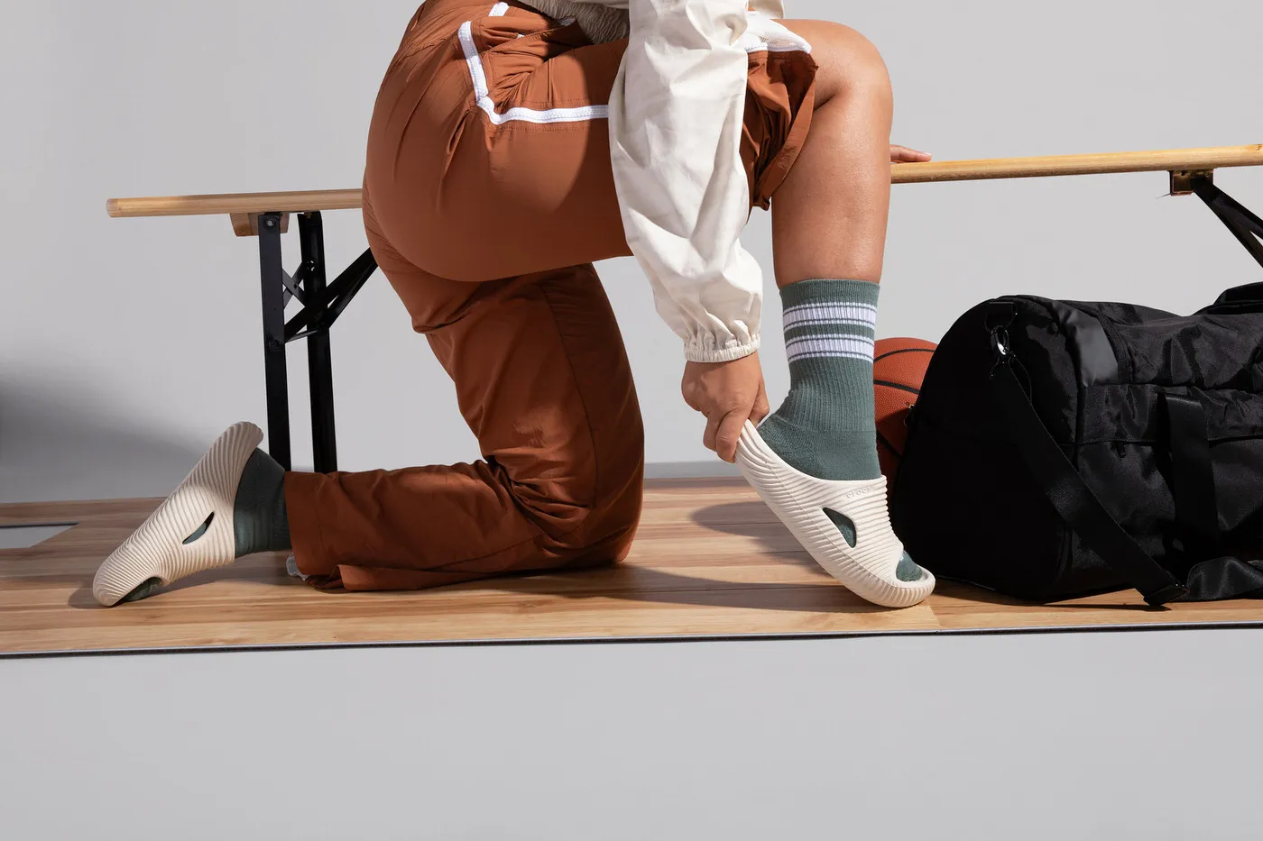 model putting on shoes